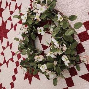 Beautiful new dog wood wreath on grape vine.